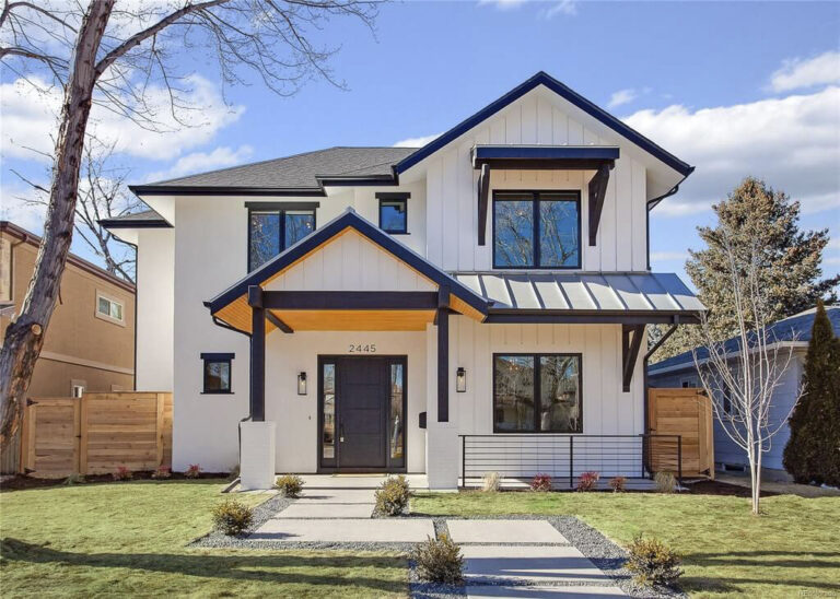 Front exterior of modern white home at 2445 S. Madison St.